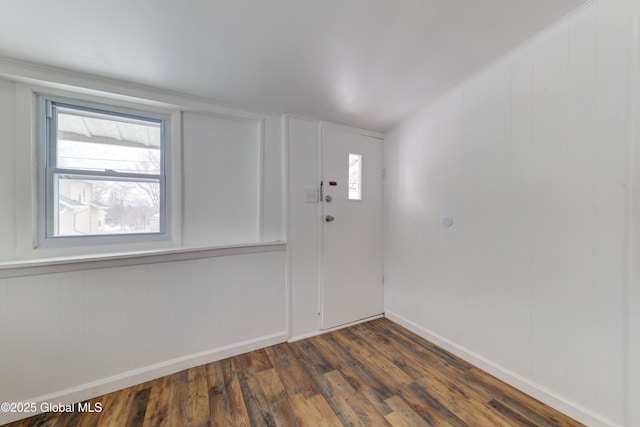 spare room featuring dark wood finished floors