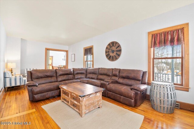 living area with hardwood / wood-style floors