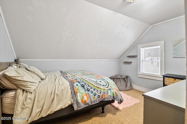 carpeted bedroom featuring lofted ceiling