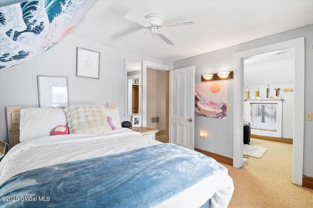 bedroom with light colored carpet, ceiling fan, and baseboards