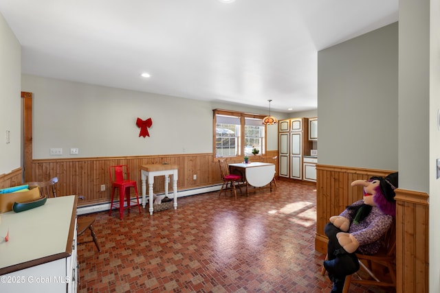 game room featuring recessed lighting, wainscoting, and wooden walls