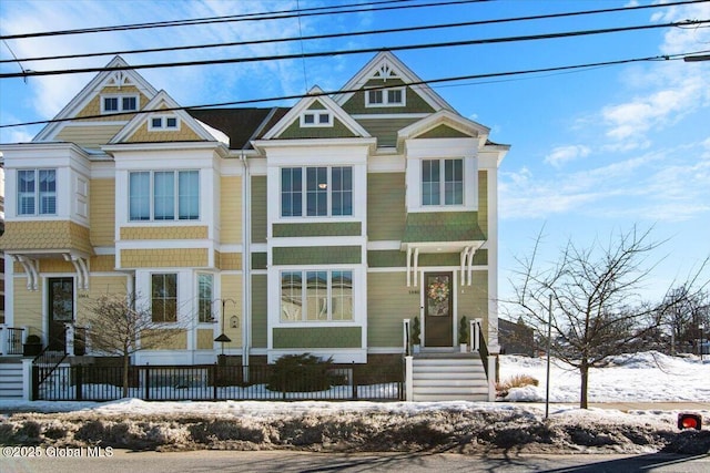 view of front of house with fence