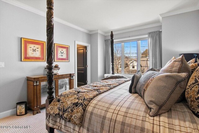 bedroom with baseboards, light colored carpet, and ornamental molding