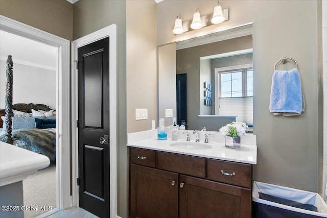 bathroom featuring vanity and crown molding