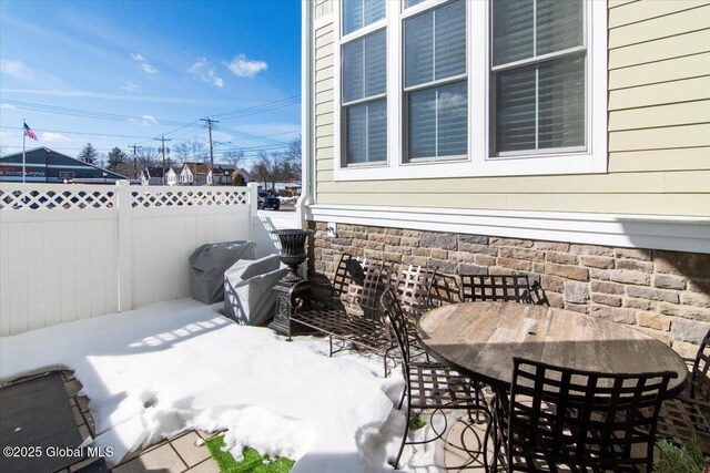 view of patio / terrace featuring outdoor dining space and fence