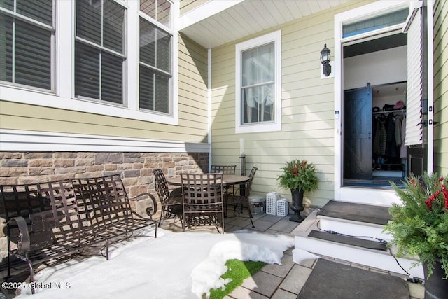 view of patio / terrace featuring outdoor dining space and entry steps