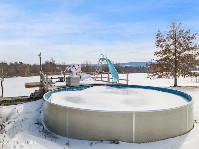 view of snow covered pool