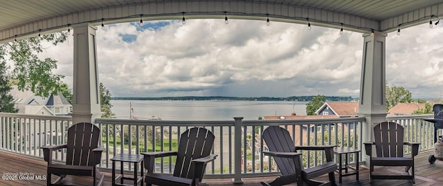 wooden terrace with a water view