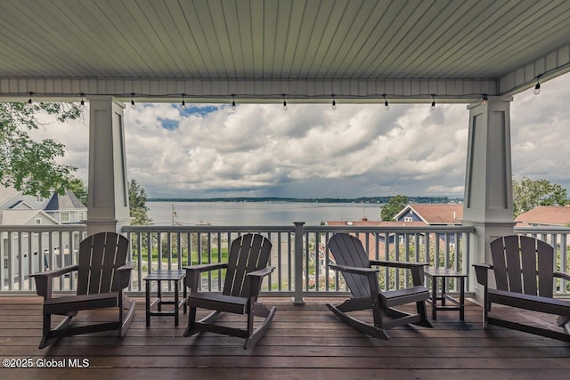 wooden deck with a water view