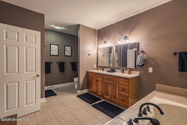 full bathroom featuring a garden tub, double vanity, toilet, a sink, and tile patterned floors