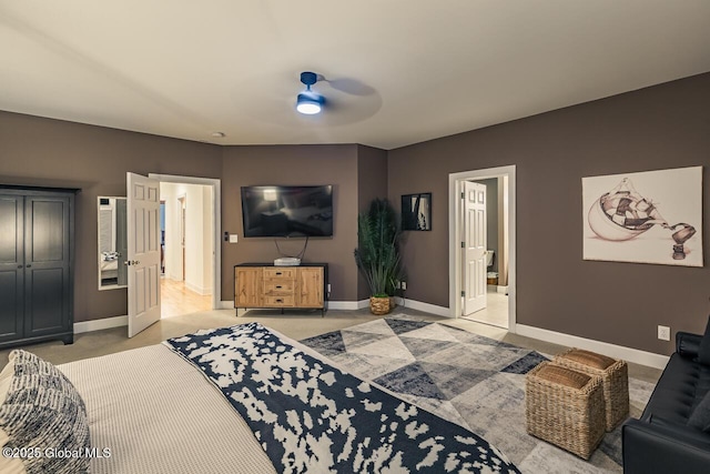 living area with light carpet and baseboards