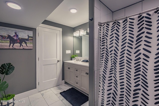 bathroom with a shower with curtain, marble finish floor, vanity, and baseboards