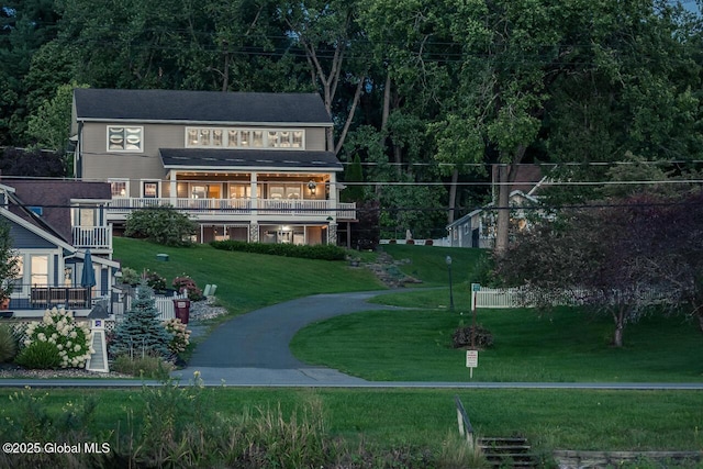 exterior space with a front yard and stairway