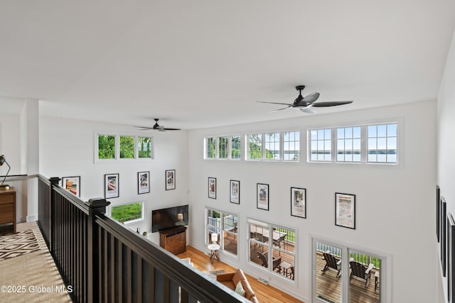 interior space featuring plenty of natural light and an upstairs landing