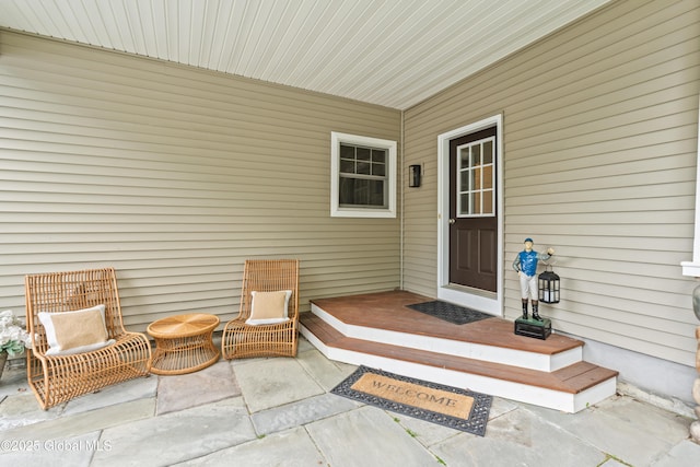 property entrance featuring a patio