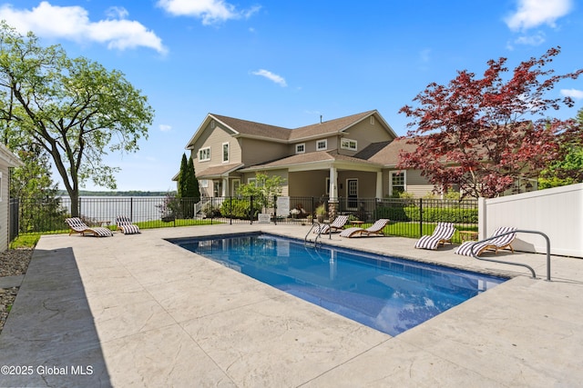 back of house with a fenced in pool, a patio area, and fence