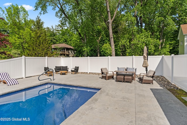 view of pool featuring a patio, outdoor lounge area, a fenced backyard, and a fenced in pool