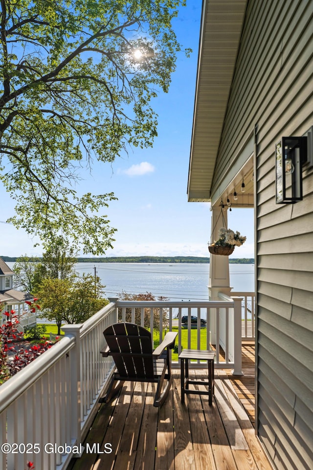 deck featuring a water view