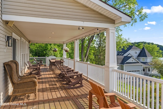 wooden deck with outdoor dining space