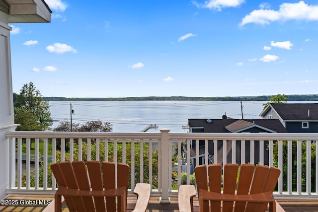 balcony featuring a water view