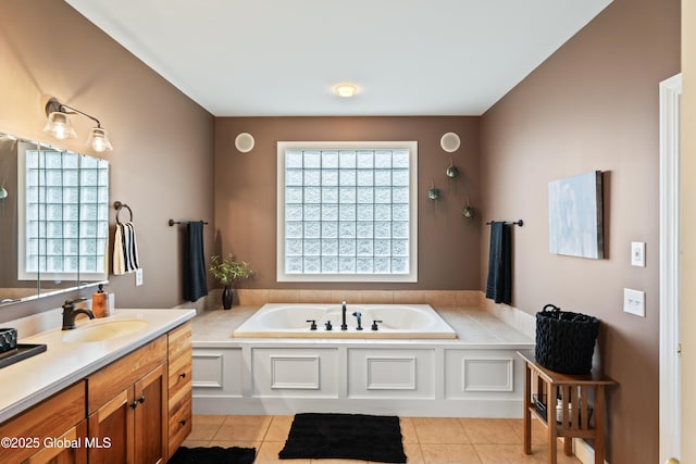 full bath with vanity, a bath, and tile patterned floors