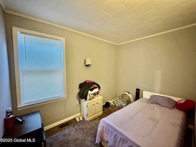 carpeted bedroom with visible vents and ornamental molding