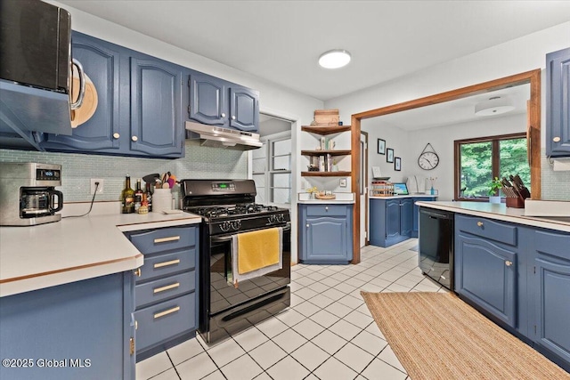 kitchen featuring blue cabinets, under cabinet range hood, light countertops, backsplash, and black appliances