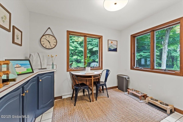 dining area featuring baseboards and light tile patterned floors