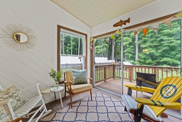 sunroom / solarium with lofted ceiling