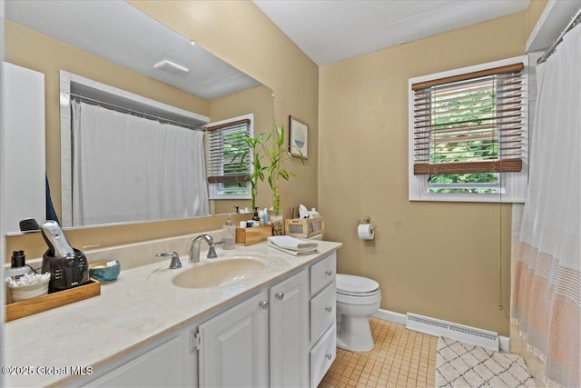 full bathroom with toilet, vanity, visible vents, baseboards, and baseboard heating