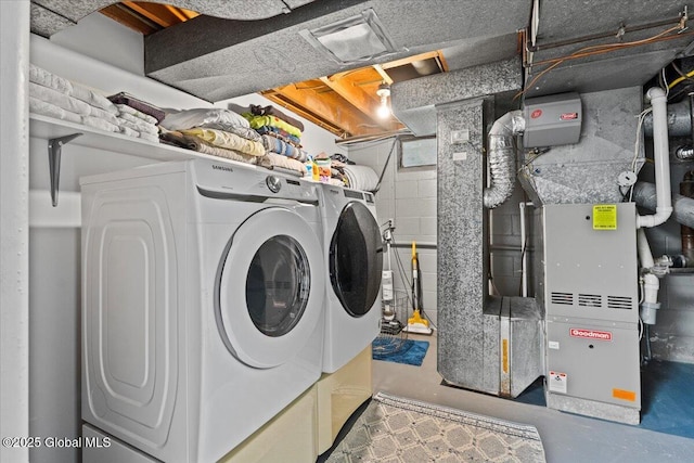 laundry room featuring laundry area and separate washer and dryer