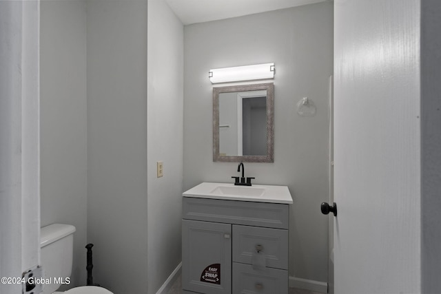 bathroom with toilet and vanity