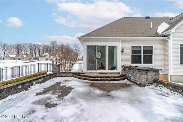 snow covered patio with fence