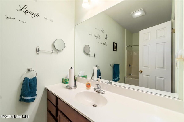 bathroom featuring shower / washtub combination and vanity