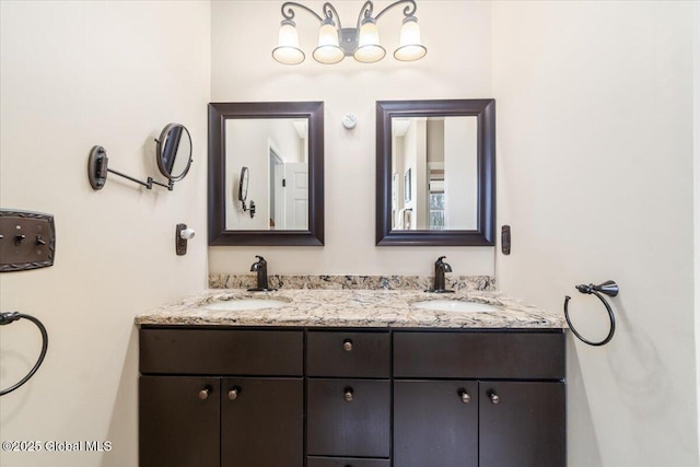 full bath with a sink and double vanity