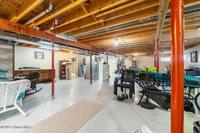 unfinished basement featuring water heater