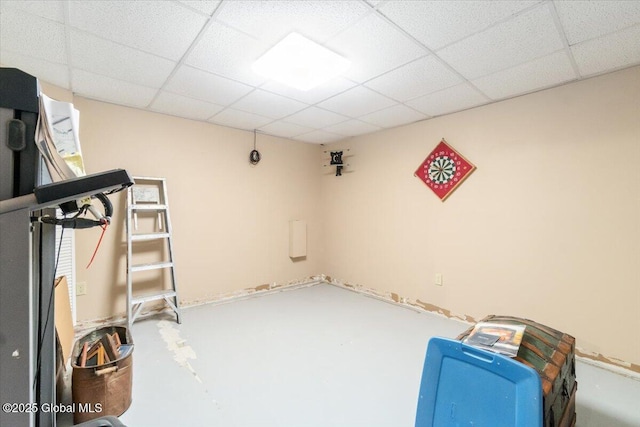 exercise room with a paneled ceiling