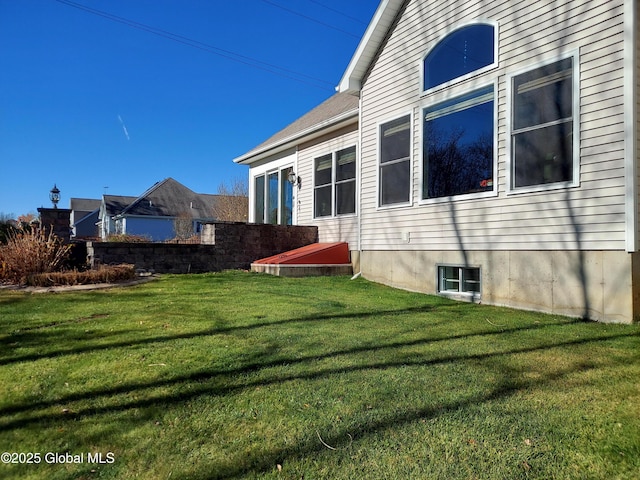 view of property exterior featuring a yard