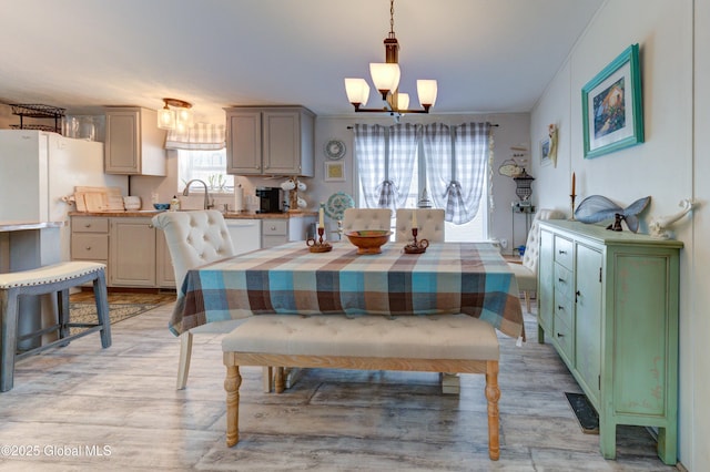 2 S Forty Rd, Hadley, NY 12835 - dining space featuring light wood-style flooring and a notable chandelier
