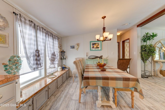 2 S Forty Rd, Hadley, NY 12835 - dining space featuring light wood finished floors and a notable chandelier