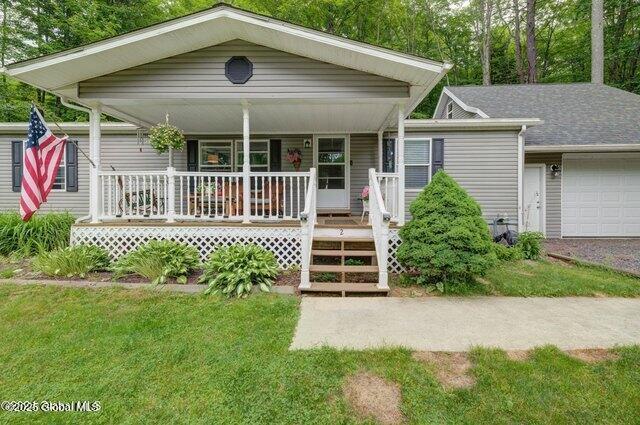 2 S Forty Rd, Hadley, NY 12835 - view of front of home with a front lawn and covered porch