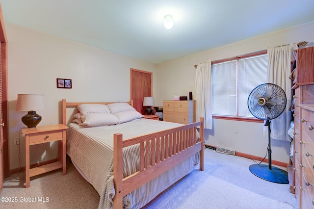 carpeted bedroom featuring baseboards