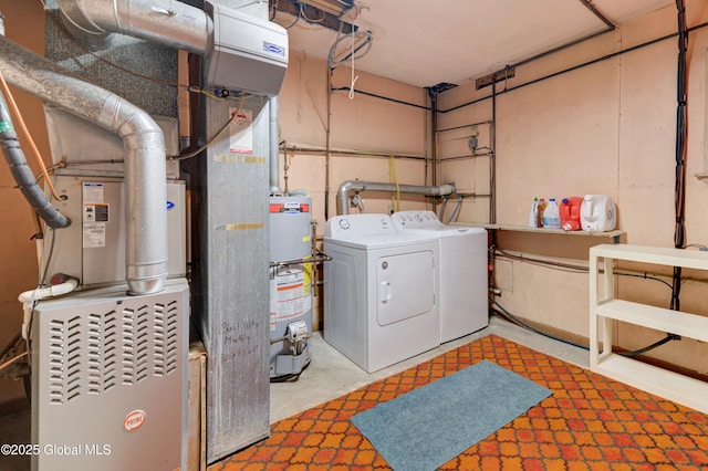 laundry room with washer and clothes dryer and gas water heater