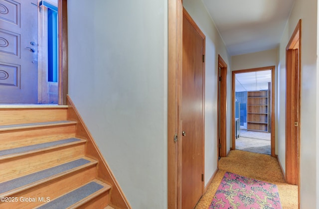 stairs with carpet flooring and baseboards