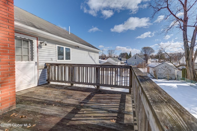 wooden terrace with a residential view