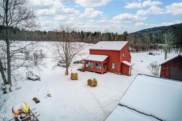 exterior space featuring a forest view