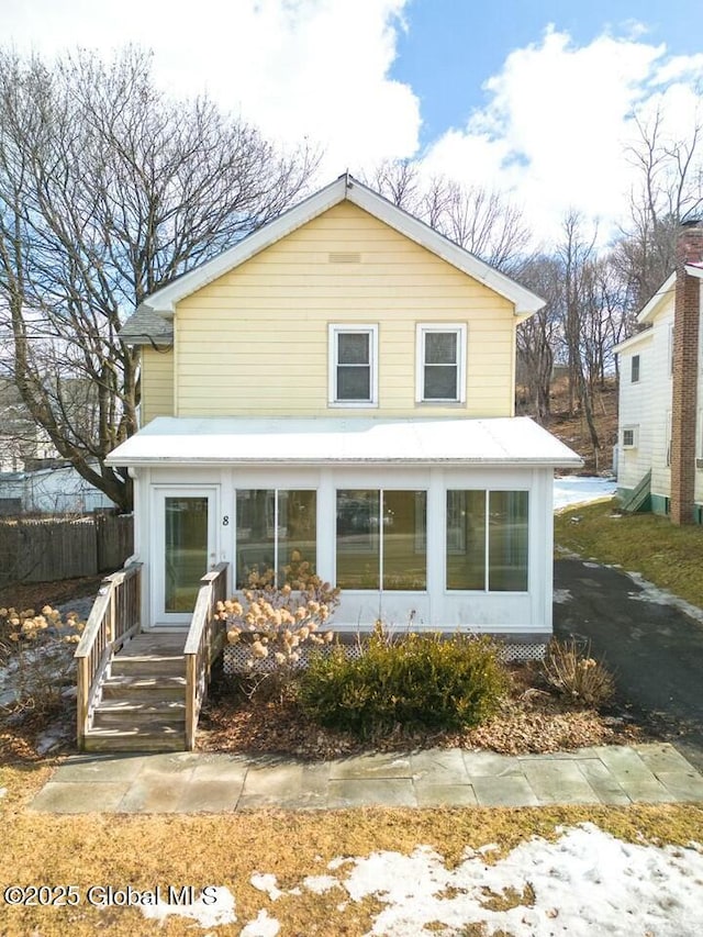 view of front facade with a sunroom