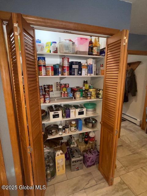 pantry with a baseboard radiator