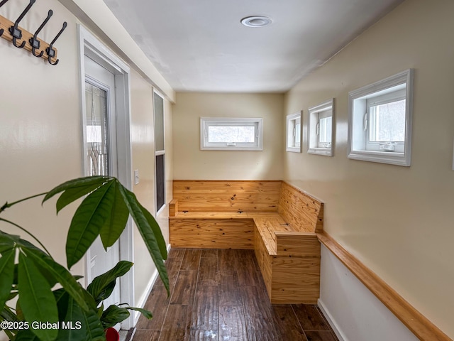 interior space with hardwood / wood-style flooring and baseboards