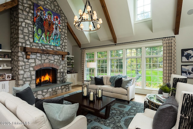 living room featuring beamed ceiling, a notable chandelier, high vaulted ceiling, wood finished floors, and a stone fireplace